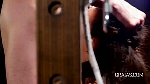 Slave endures pussy whipping in BDSM scene