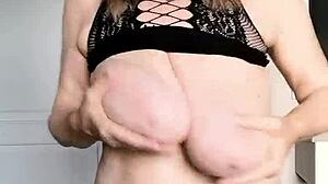 Look at this MILF in black net dress with huge tits and pussy close-up!