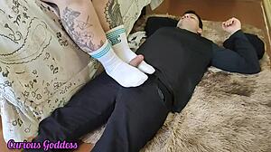 Curious goddess explores footjob in white socks
