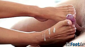 babe feels intense pleasure from footjob and fingering, leading to cumshot on her feet