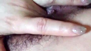 Chinese milf masturbates